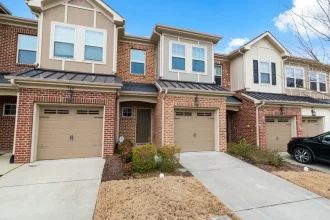 Front view of townhouses in a neighborhood.