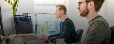 Employees doing computer work in an office.
